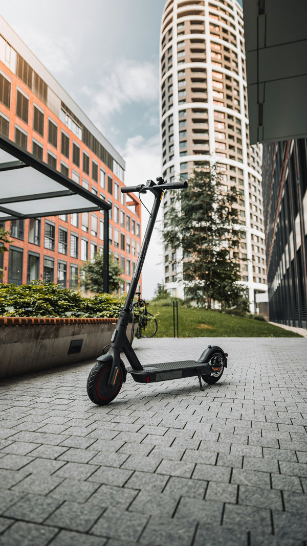 Electric scooter parked outside, ready to be sent with Rydiqo® Delivery